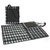 A picnic blanket in grey and black plaid design, folded with a carry handle and pocket on the side. A picnic blanket in grey and black plaid design, folded with a carry handle and pocket on the side.