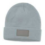 A light blue beanie with a textured knit pattern and a patch on the front. A light blue beanie with a textured knit pattern and a patch on the front.