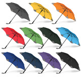 A variety of BLUNT Classic Umbrellas in grey, yellow, red, green, black, and purple, featuring a logo.