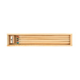 A wooden box containing coloured pencils in various colours, alongside a sharpener. A wooden box containing coloured pencils in various colours, alongside a sharpener.