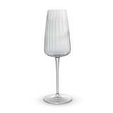 A clear, elegant flute glass with vertical ribbed design and a slender stem, featuring a round base. A clear, elegant flute glass with vertical ribbed design and a slender stem, featuring a round base.