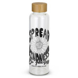 A clear glass drink bottle with a bamboo lid, featuring a floral design and printed words in black. A clear glass drink bottle with a bamboo lid, featuring a floral design and printed words in black.