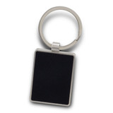 A rectangular black key ring with a silver metal keychain. It features a smooth surface and a polished finish. A rectangular black key ring with a silver metal keychain. It features a smooth surface and a polished finish.