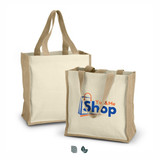 Two natural canvas tote bags with tan handles, one larger and one smaller, featuring a logo on the side.