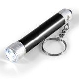 A black torch with a silver keyring attachment, featuring a textured grip and bright LED light. A black torch with a silver keyring attachment, featuring a textured grip and bright LED light.