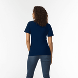 A woman with curly hair wearing a navy blue polo shirt, viewed from the back. The shirt has a simple design and a logo. A woman with curly hair wearing a navy blue polo shirt, viewed from the back. The shirt has a simple design and a logo.