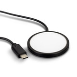 A black wireless charger with a circular design and a connected USB-C cable. A black wireless charger with a circular design and a connected USB-C cable.