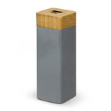 A grey power bank with a bamboo top and a logo, designed for charging devices. A grey power bank with a bamboo top and a logo, designed for charging devices.