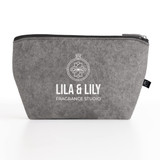 A grey felt pouch with a zip closure, featuring a logo on the front. Suitable for toiletries and accessories.