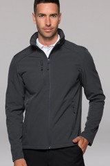 A man wearing a grey soft shell jacket with a high collar, featuring zipped pockets and a logo.