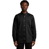 A black button-up denim wash shirt with a chest pocket and a collar. The model is standing and facing the camera.