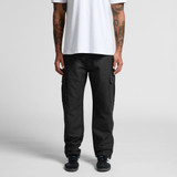 Utility cargo pants in black worn by a model, featuring side pockets and a casual fit.