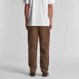 Brown cord pants displayed on a model, showing the back view, paired with a plain white t-shirt.