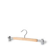 A wooden clip hanger with chrome clips and a metal hook, featuring a branding logo on the wood. A wooden clip hanger with chrome clips and a metal hook, featuring a branding logo on the wood.