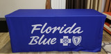 A fitted table cover in blue with a logo, designed for a 4-foot table. A fitted table cover in blue with a logo, designed for a 4-foot table.