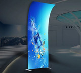 A tension fabric display featuring a vibrant blue design with a water bottle and splashes, set in a modern indoor space.