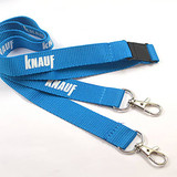 A blue polyester lanyard with two clips and a buckle, featuring a logo along its length. A blue polyester lanyard with two clips and a buckle, featuring a logo along its length.
