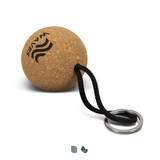 A round cork key ring with a black cord attachment and a metal key ring, featuring a logo. A round cork key ring with a black cord attachment and a metal key ring, featuring a logo.
