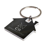 A house-shaped stainless steel keytag in black and white with a keyring, featuring a logo. A house-shaped stainless steel keytag in black and white with a keyring, featuring a logo.