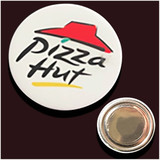 A white button badge featuring a red hat design and a logo, with a shiny silver backing. A white button badge featuring a red hat design and a logo, with a shiny silver backing.
