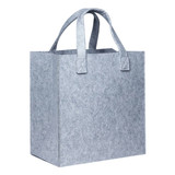 A grey felt tote bag with two sturdy handles and a square shape, featuring a logo on one side.