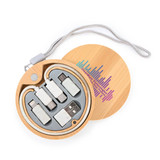 A round bamboo case containing a variety of charging cables in grey, white, and silver. It includes a logo. A round bamboo case containing a variety of charging cables in grey, white, and silver. It includes a logo.
