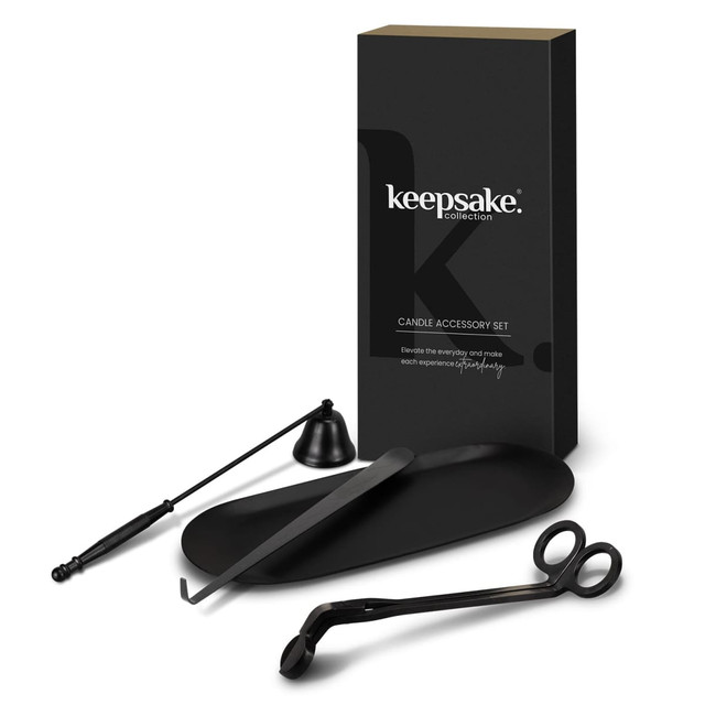 A candle accessory set featuring a black candle snuffer, wick trimmer, and dipper, presented in a sleek black box. A candle accessory set featuring a black candle snuffer, wick trimmer, and dipper, presented in a sleek black box.
