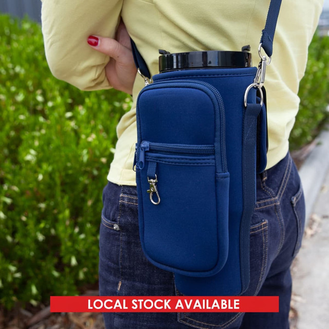 A drink bottle carrier in navy neoprene, featuring a zippered pocket and adjustable strap.