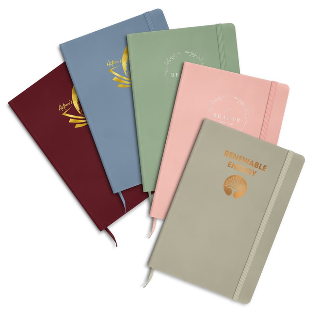A collection of five notebooks in various colours: blue, green, pink, burgundy, and beige, each with foil printing and a logo.