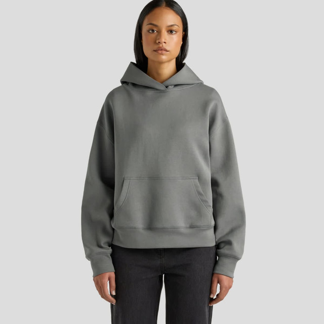 A hooded sweatshirt in a soft grey colour, featuring a front pocket and a relaxed fit.