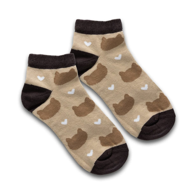 Pixel knitted ankle socks in beige with brown bear shapes and white hearts, featuring a dark brown cuff and sole.