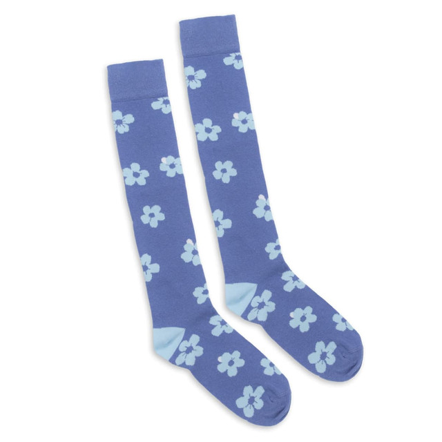 Knee-high socks in a blue hue, featuring light blue floral patterns throughout. The socks have a logo on them.