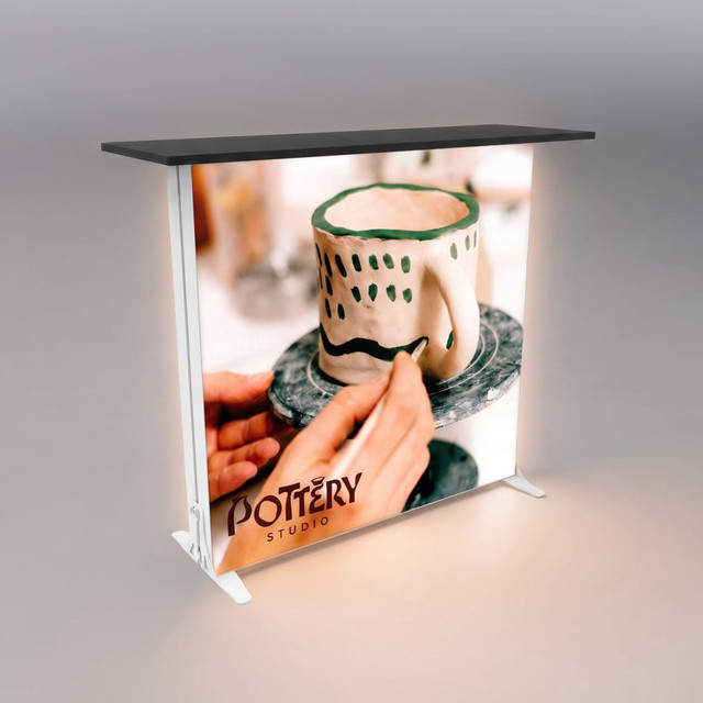 A portable event lightbox counter with a black top and illuminated sides featuring a pottery design.