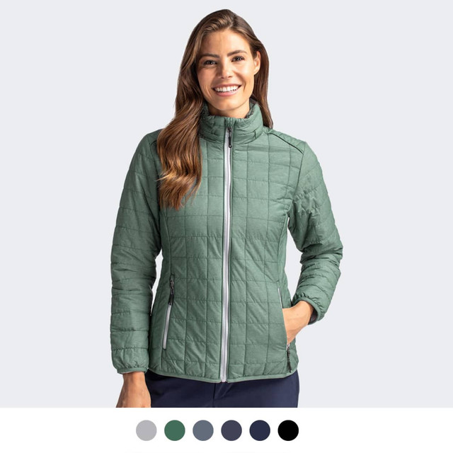 A quilted women's jacket in green, featuring a zip front and a logo on the chest. Available in various colours below.