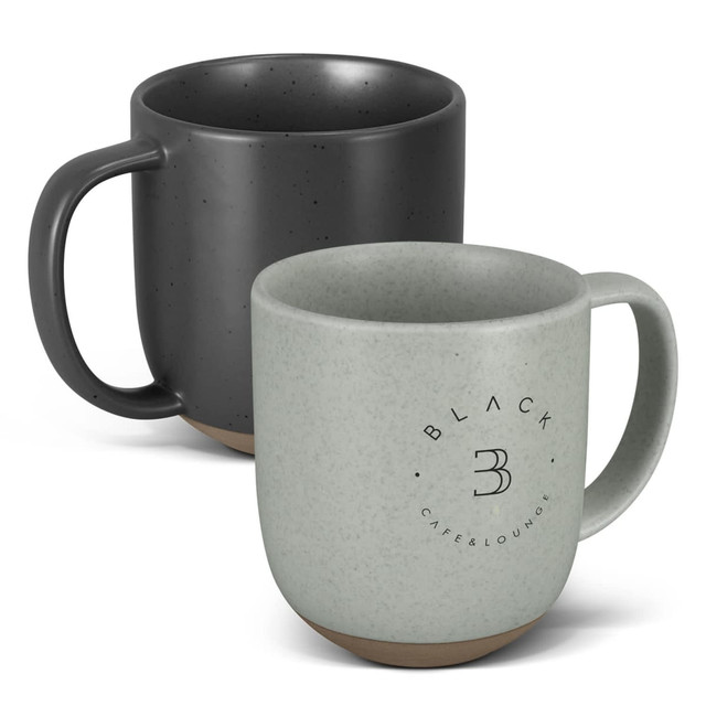 A ceramic mug set featuring a speckled black mug and a speckled green mug, both with contrasting bases and logos. A ceramic mug set featuring a speckled black mug and a speckled green mug, both with contrasting bases and logos.