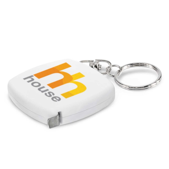 A white tape measure key ring with a silver keychain and a logo on the front. A white tape measure key ring with a silver keychain and a logo on the front.