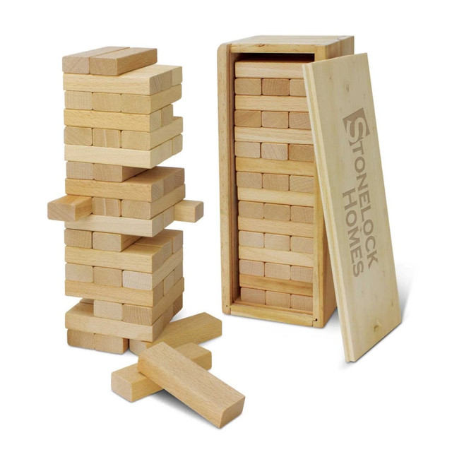 A wooden tumbling tower game with light-coloured blocks, featuring a storage box and an open lid. A wooden tumbling tower game with light-coloured blocks, featuring a storage box and an open lid.