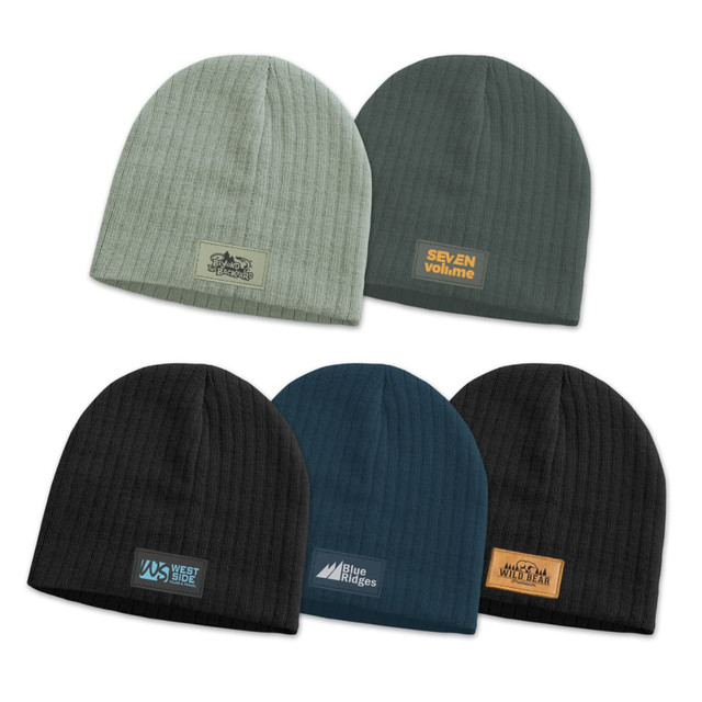 A collection of Nebraska cable knit beanies in various colours, featuring different patches and logos. A collection of Nebraska cable knit beanies in various colours, featuring different patches and logos.