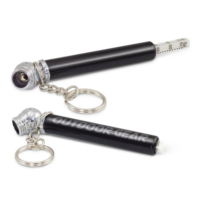 A tyre pressure gauge key ring in black and silver, featuring a key chain and a silver cap. A tyre pressure gauge key ring in black and silver, featuring a key chain and a silver cap.