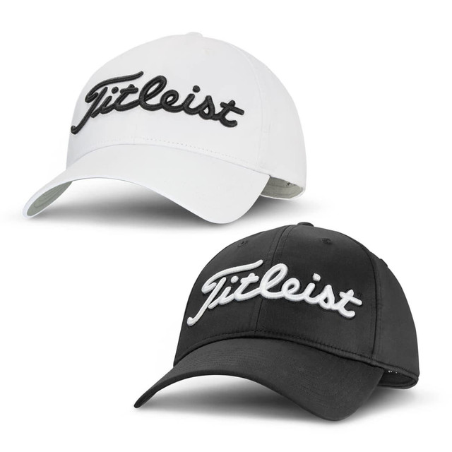 Two Titleist Tour Performance Caps are displayed, one in white and one in black, each featuring a branded logo. Two Titleist Tour Performance Caps are displayed, one in white and one in black, each featuring a branded logo.