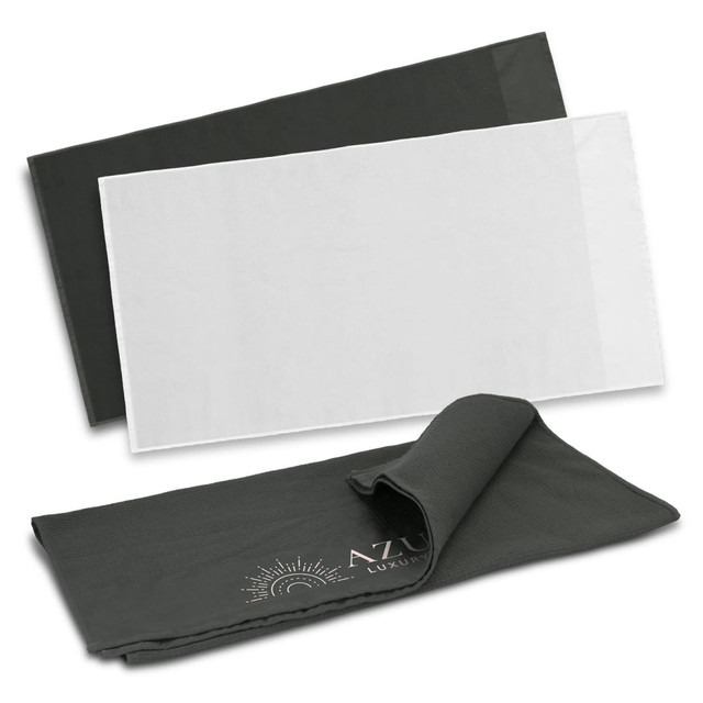 Two waffle towels are displayed, one in dark green and one in white, with a logo on the dark green towel. Two waffle towels are displayed, one in dark green and one in white, with a logo on the dark green towel.