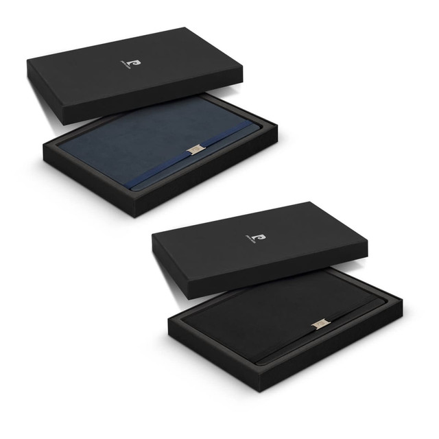 A gift set featuring two notebooks in navy and black, presented in a sleek black box with a logo. A gift set featuring two notebooks in navy and black, presented in a sleek black box with a logo.