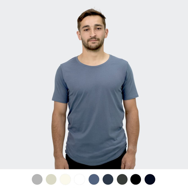 A man models a blue TRENDSWEAR Carmen Men's T-Shirt. Various colour options are displayed below.