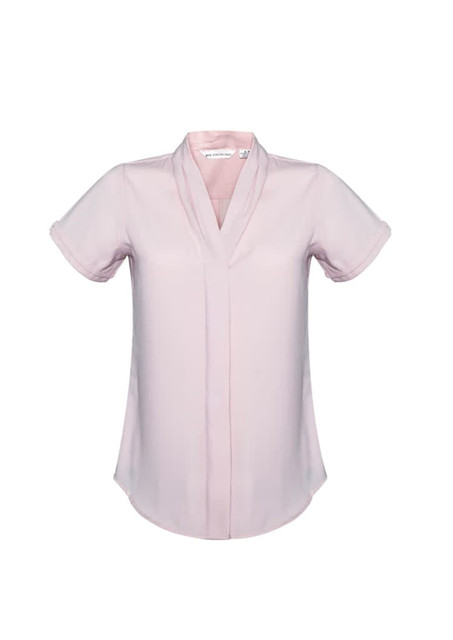 A short sleeve button-up shirt in a soft pink colour, featuring a v-neck design and a logo on the label.