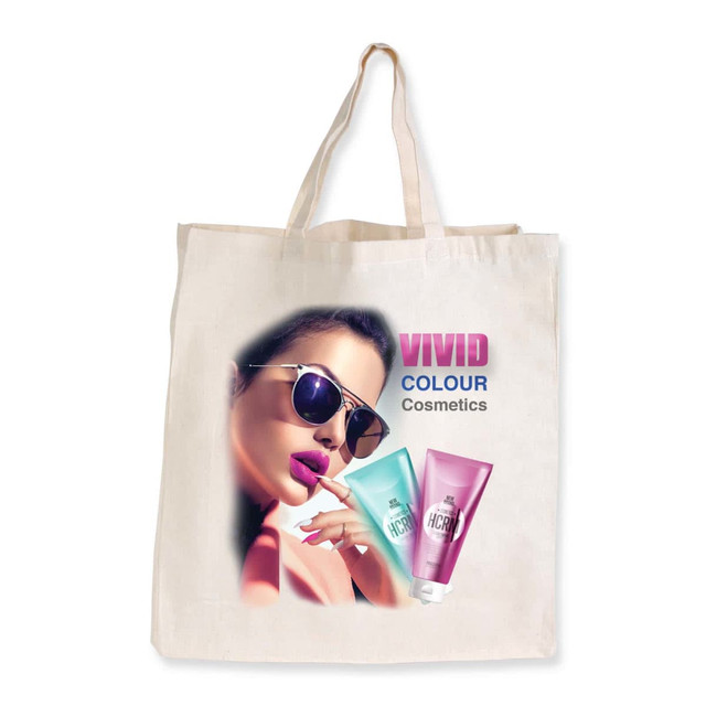 A cream calico bag with a stylish graphic design featuring sunglasses and cosmetic tubes, along with a logo.
