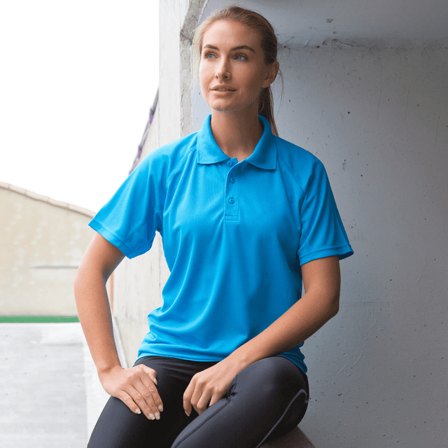 A bright blue polo shirt with short sleeves, featuring a collar and three buttons, displayed on a model. A bright blue polo shirt with short sleeves, featuring a collar and three buttons, displayed on a model.