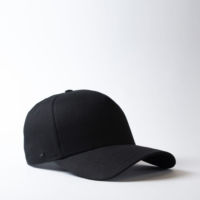 A black five-panel snapback cap with a flat brim and an adjustable strap at the back. It features a logo.