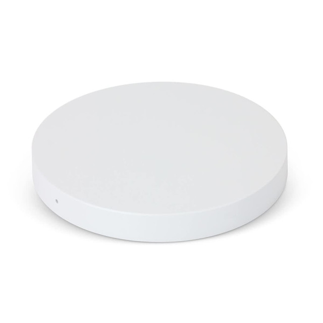 A round white wireless charger with a smooth surface and a single small port on the side. A round white wireless charger with a smooth surface and a single small port on the side.