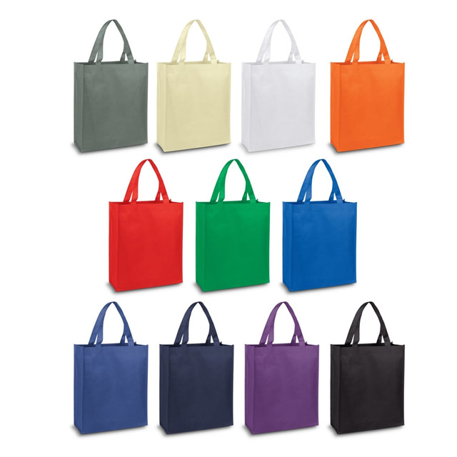 A variety of Kira A4 Tote Bags in grey, yellow, white, orange, red, green, blue, purple, and black, with handles and branding.