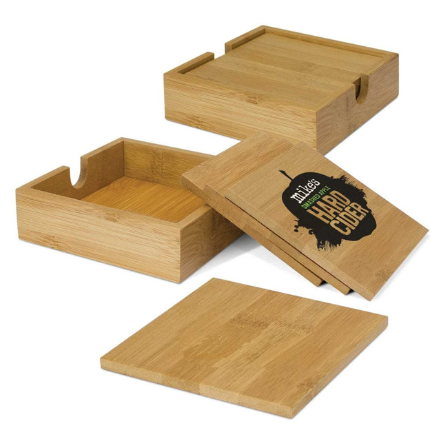 Bamboo coasters in natural tones, featuring a box and lids, with a logo on one of the coasters. Bamboo coasters in natural tones, featuring a box and lids, with a logo on one of the coasters.